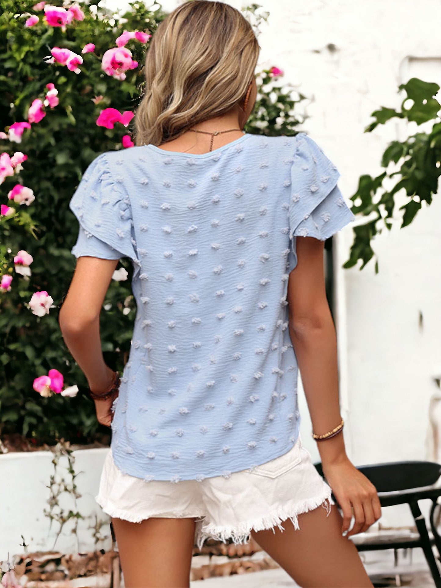 Blusa con cuello redondo y lazo