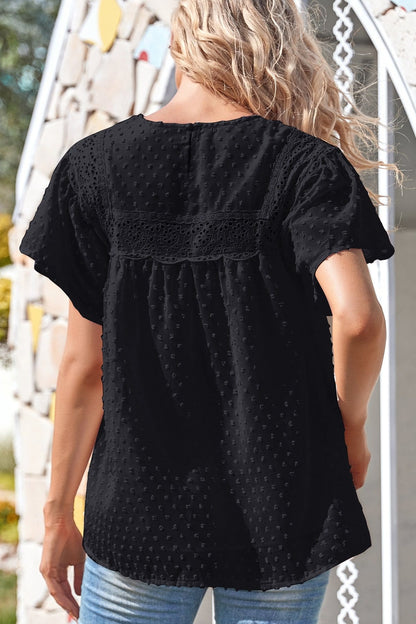 Blusa de lunares con encaje y mangas abullonadas