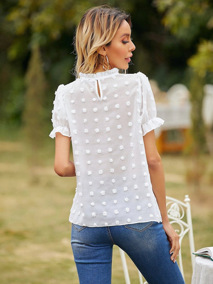 Blusa de lunares con pinza y mangas abullonadas