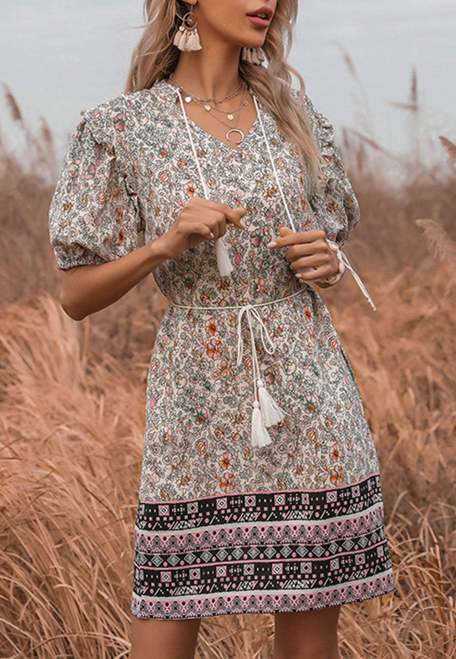 Vestido midi bohemio con detalle de lazo y borlas