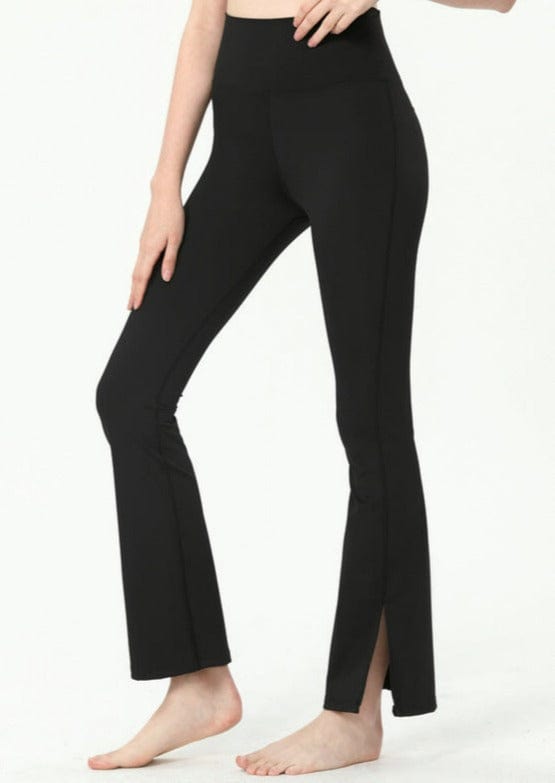 Black sports flare pants with slit for women, ankle length gym pants.