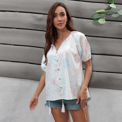 Blusa floral con lazo en el cuello y borlas