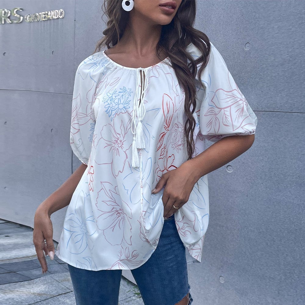 Blusa floral con lazo en el cuello y borlas