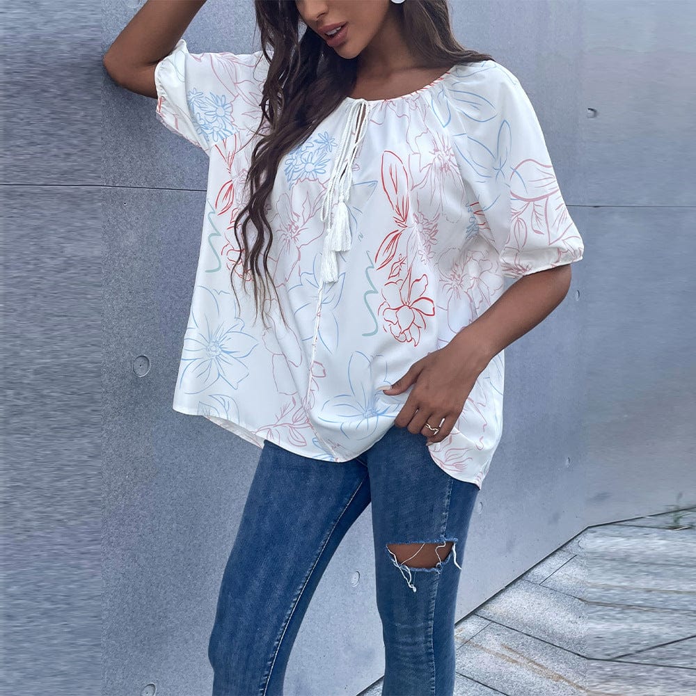 Blusa floral con lazo en el cuello y borlas