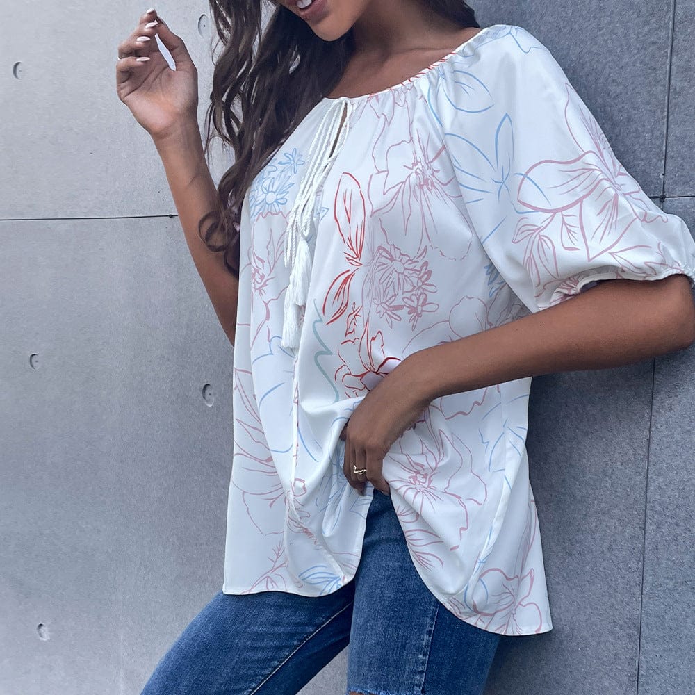 Blusa floral con lazo en el cuello y borlas