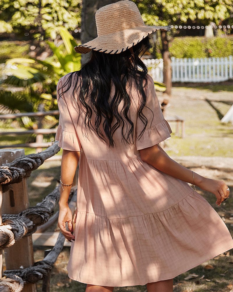 Vestido escalonado con detalle de botones a cuadros